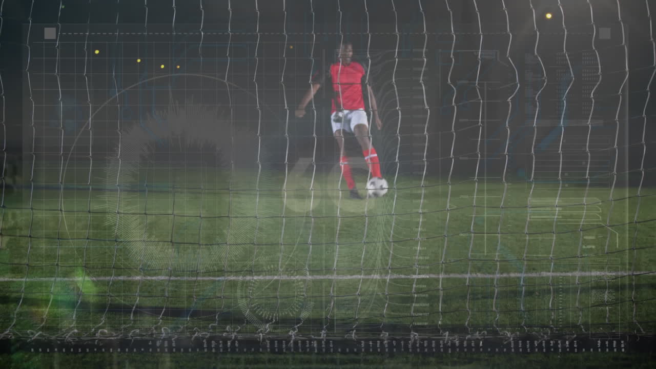 페널티?? 을 치는 아프리카계 미국인 남자 축구 선수에 대한 데이터 처리의 애니메이션.