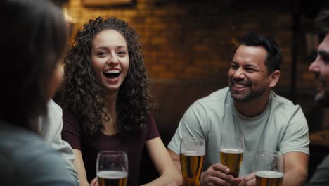 mid shot video of group of friends spending time in the pub