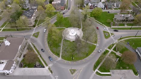 Traffic-circle-in-downtown-Marshall,-Michigan-with-drone-video-at-an-angle-stable