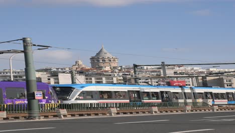 tram traveling past galata tower in istanbul