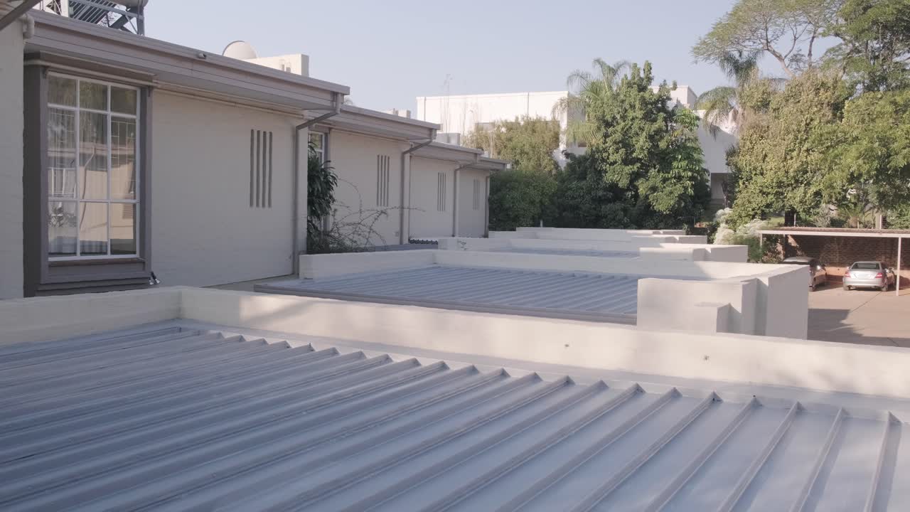 Wide shot of painted complex roofs