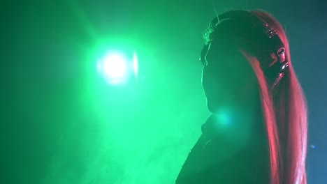 dj woman silhouette in neon lighting