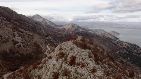 Beautiful-wide-establishing-aerial-shot-of-Lake-Skadar-and-mountains-in-Southern-Europe