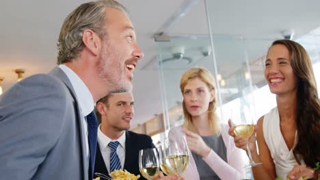 Businessmen-and-colleagues-having-wine