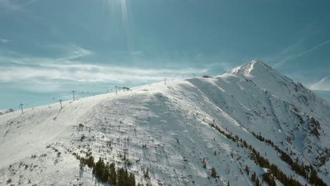 Ski-Resort-Chairlift-on-Bulgaria-Snow-Covered-Mountains-in-Europe,-Aerial