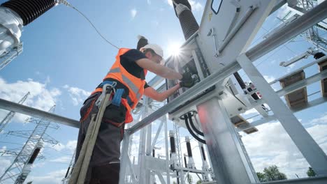 electrical engineers inspect the electrical systems at the equipment control cabinet