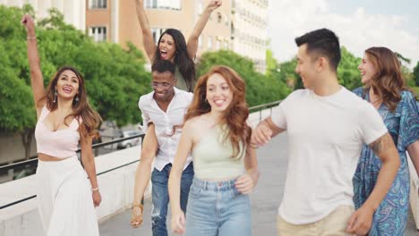 happy diverse group of friends having fun walking outdoors