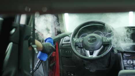 professional car cleaning. сar wash. interior detailing. dry clean and detail a car interior. deep seats cleaning. wiping foam in car wash. cleaning the car panel from dust. a vacuum cleaner