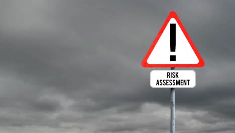 Attention-signboard-post-with-risk-assessment-text-against-dark-clouds-in-the-sky