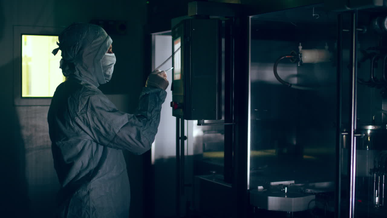 Pharmaceutical worker control automated production line at pharmaceutical plant