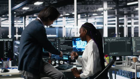 senior engineer and trainee in data center working on neural networks