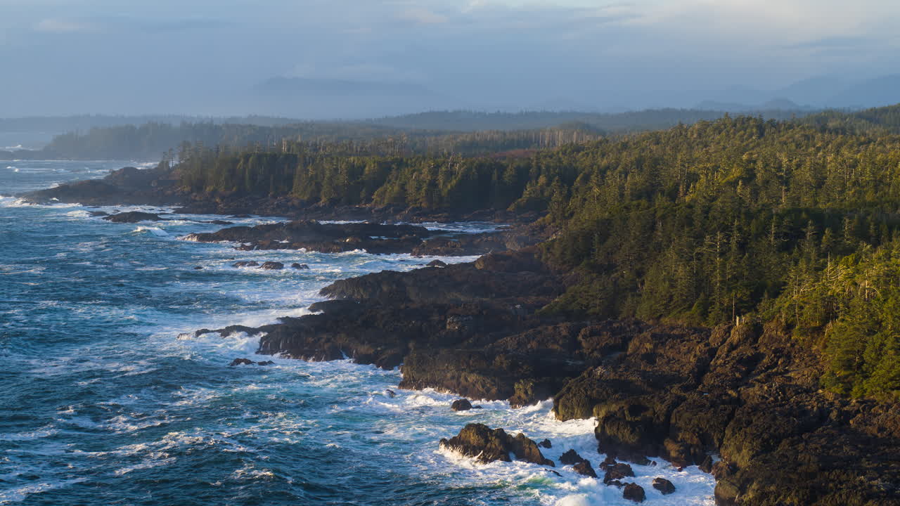 Drone video at sunset in Ucluelet British Columbia, Canada over the ocean and forest