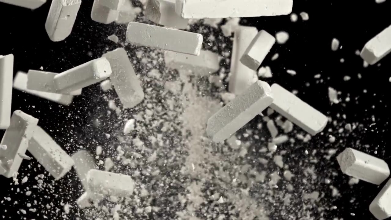 White Chalk Sticks Exploding and Dispersing Dust in Slow Motion