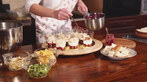 woman making trifle dessert