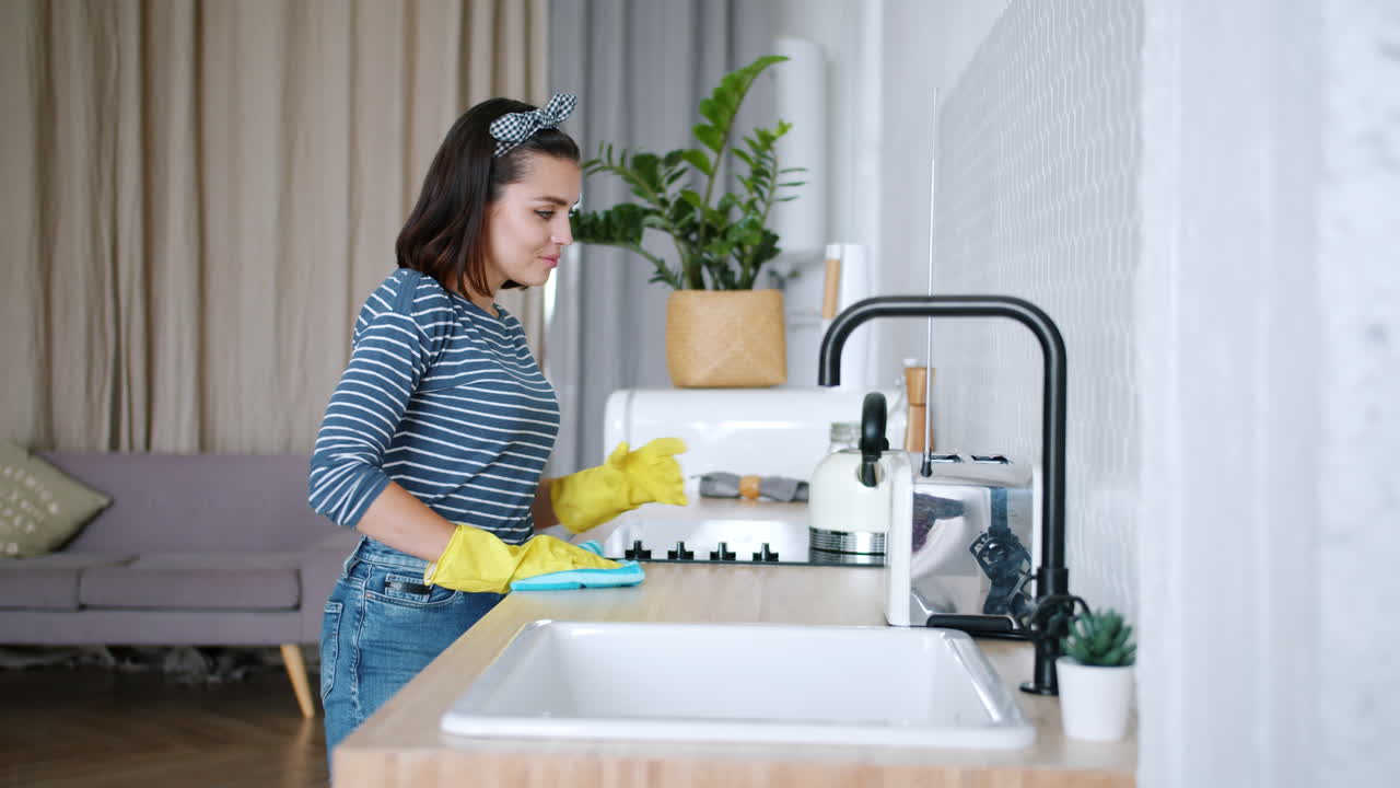 Woman Cleaning a Kitchen
