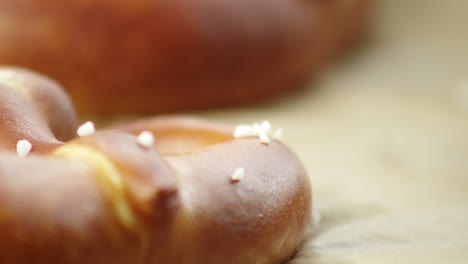 Slow-Pan,-closeup-of-salted,-baked-pretzel