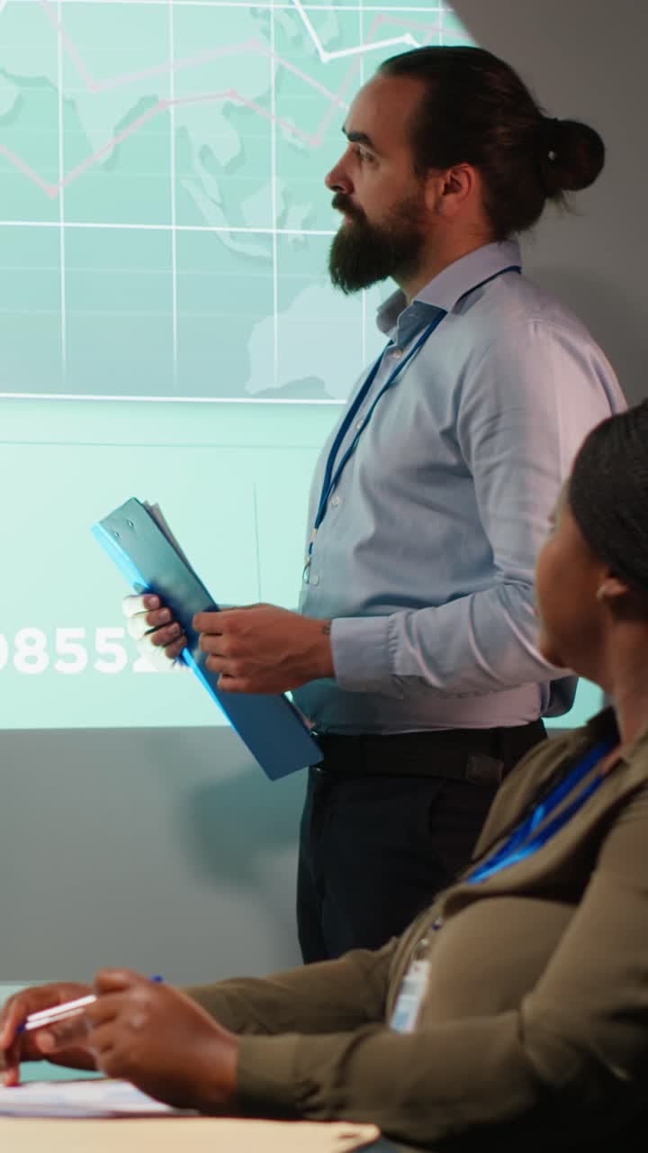 Vertical Video Diverse staff from an enterprise sharing data analytics and insights