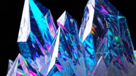 vibrant iridescent crystals on black background