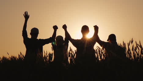 The Team Of Farmers Raise Their Hands Up Together In A Sign Of Success And Confidence In The Team