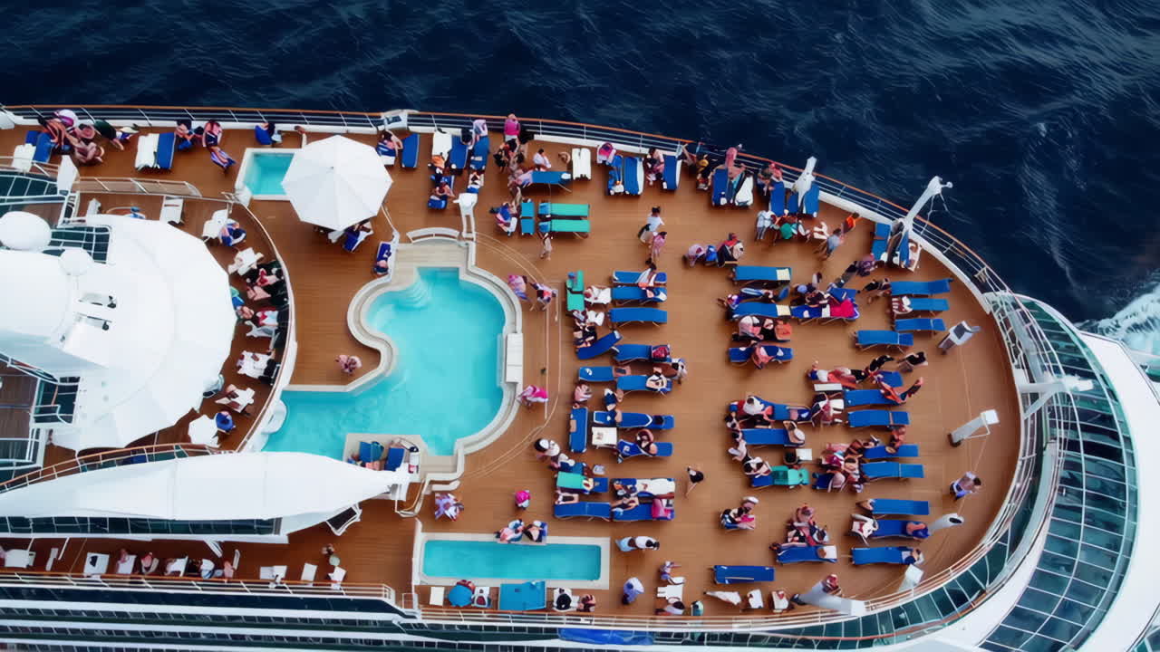 Aerial view of people relaxing on a cruise ship deck with swimming pools