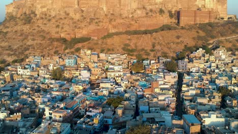 sunrise fly over of densely populated, blue city of jodhpur, rajasthan, india