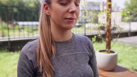 pregnant woman meditate at the garden