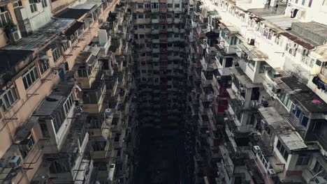 aerial of an old apartment complex called yick fat on quarry bay, hong kong, china