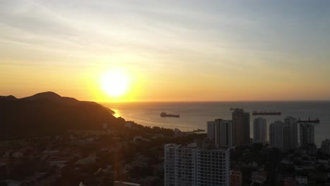 Sun-shining-on-ocean-and-buildings-in-Latin-American-city