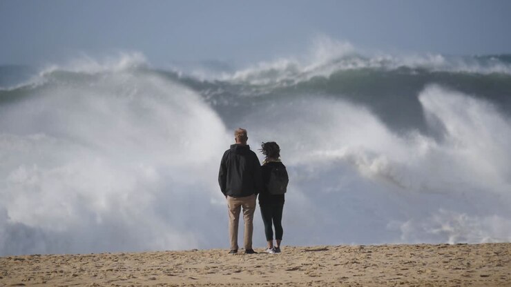 Slow motion of a wave break on the beach in Nazaré, Portugal