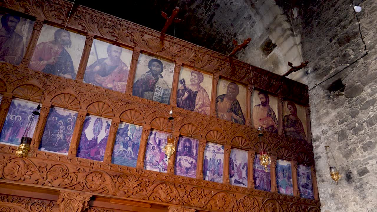 Explore the stunning interior of a historic church featuring rich wooden carvings and vibrant icons. Unique artwork and beautiful details capture the essence of this sacred space