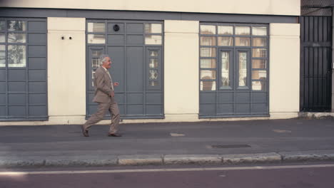 Contemporary-funky-elderly-man-street-dancer-dancing-freestyle-in-the-city