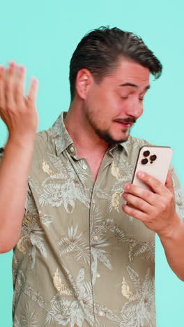 man scrolling smartphone suddenly hitting forehead with palm remembering important task or deadline