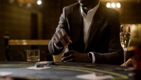 man playing poker at the casino.