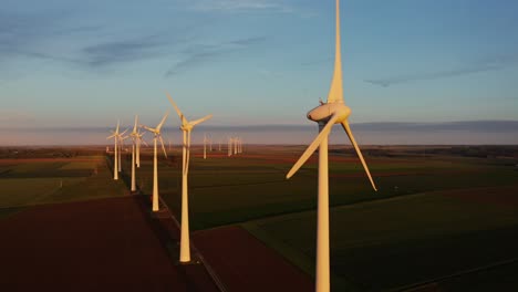 sunrise over a wind farm