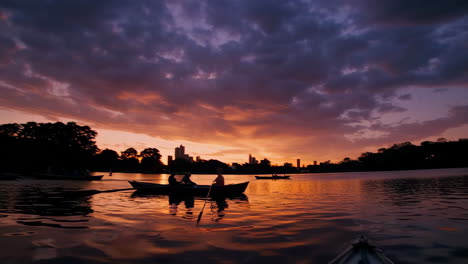 boats on a lake at sunset