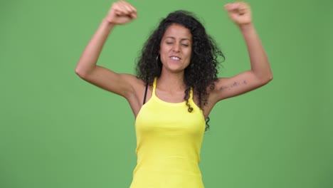 young beautiful hispanic woman looking excited