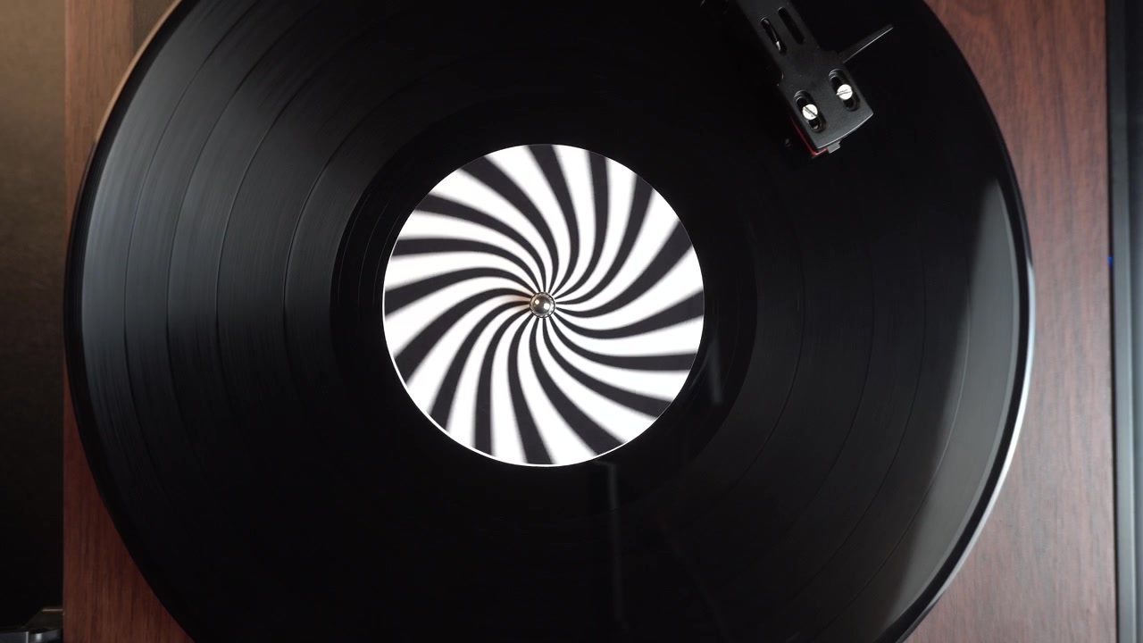 Top Down View, Starting Playback of Music on Vinyl Record With Optical Illusion Sticker