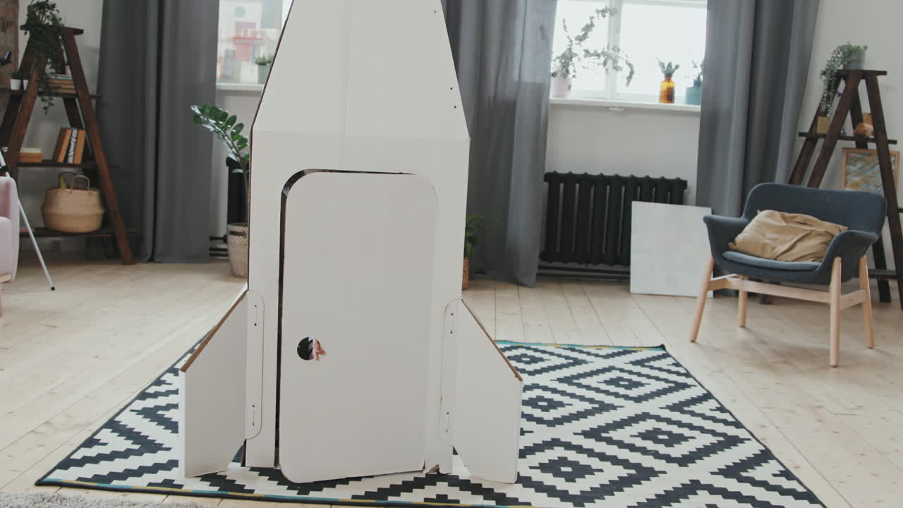 Cute Girl in Spacesuit Exiting Rocket Ship and Waving