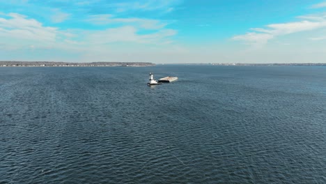 Far-away-parallax-view-of-a-Tugboat-and-a-barge