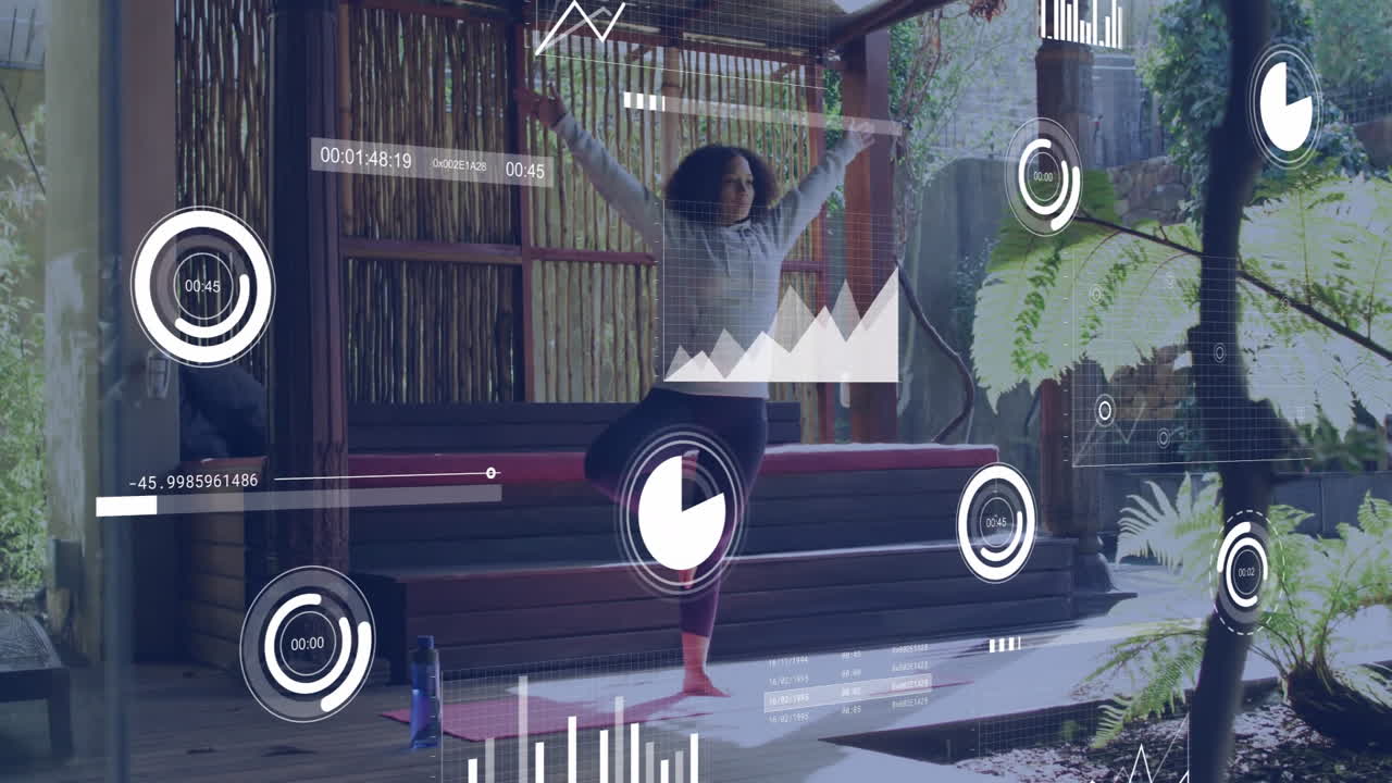 Practicing yoga at home, woman using animation with fitness data graphics