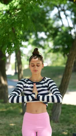 woman practicing yoga and stretching outdoors