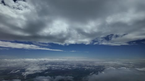 a pilot’s perspective of a peaceful sky with some ethereal fluffy clouds seen from the sky. 4k