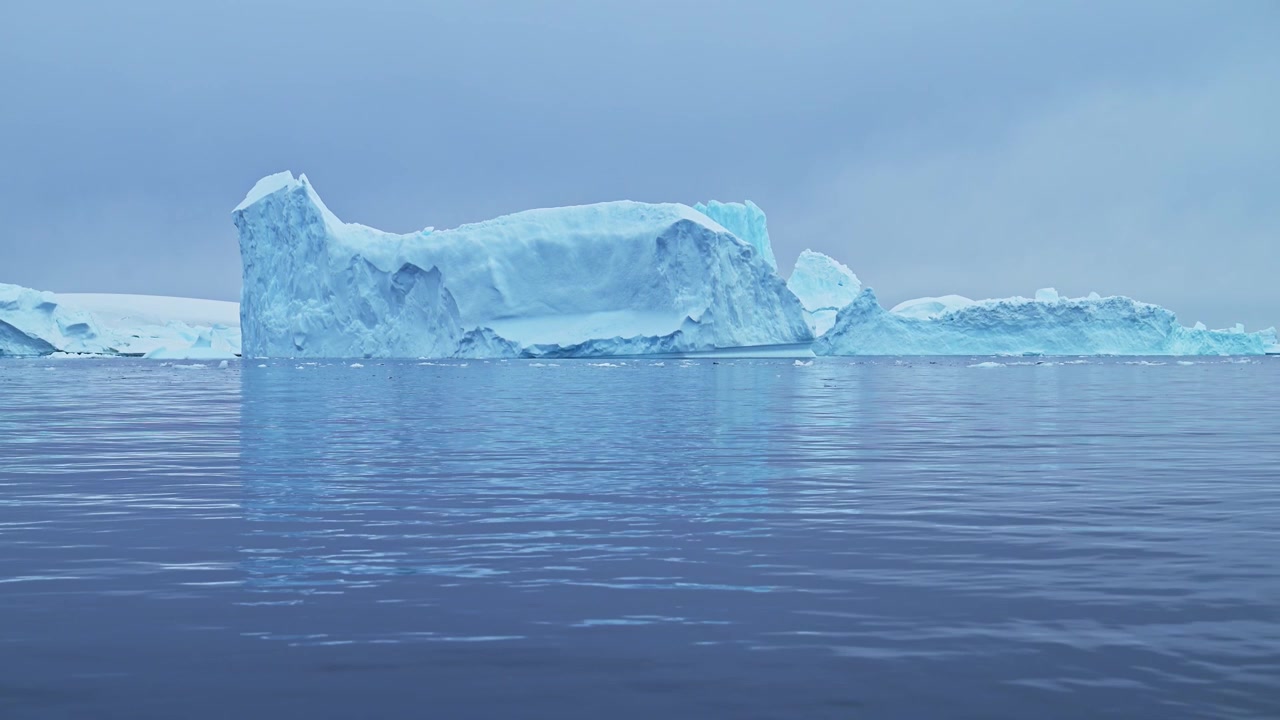 Antarctica Dramatic Iceberg Scenery with Amazing Shapes of Big Blue Icebergs, Massive Bizzare Beautiful Icebergs in Ocean Sea Water in Cold Winter Seascape Landscape on Antarctic Peninsula