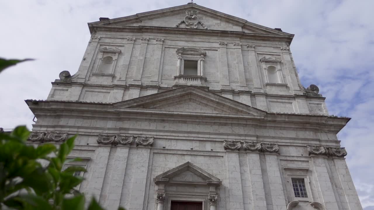 Stone fa&ccedil;ade of the church San Filippo Neri with varied tympani over doors and windows and Corinthian pilasters