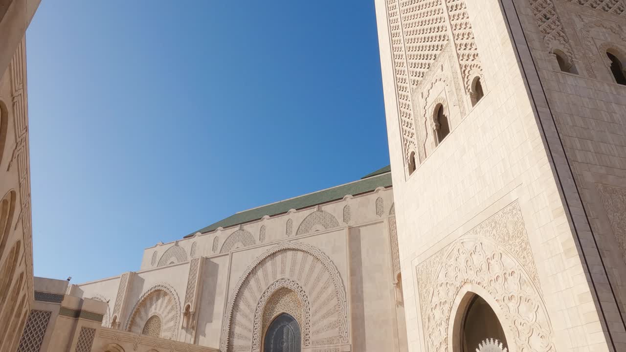 Hassan II Mosque, Casablanca, Morocco, courtyard view and tilt-up reveal of minaret