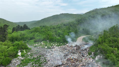 Aerial view of a garbage dump that is burning in places