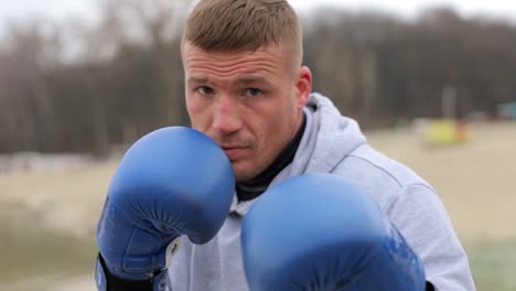 boxer boxing into camera lens slow motion boxer fight with shadow in nature boxing workout