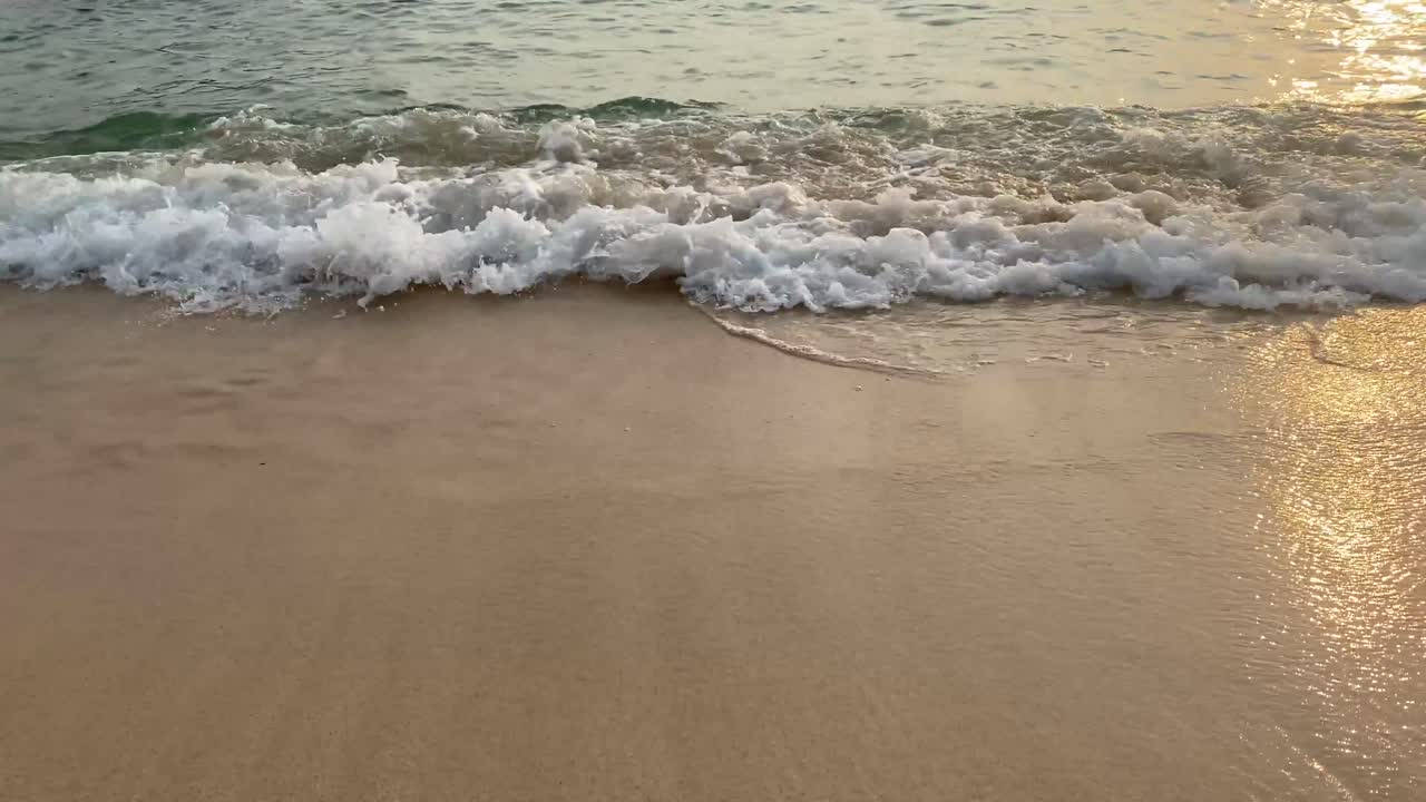 the sound of waves crashing at sunset