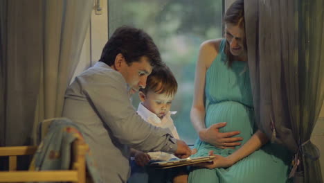 united family watching the tablet