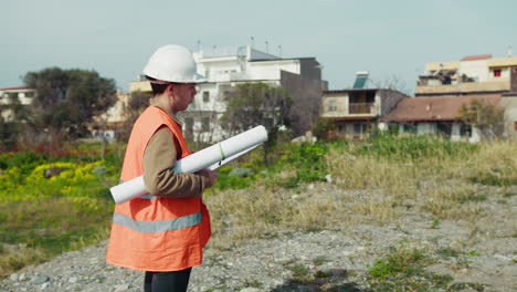doubtful architect thinking and taking notes while on the construction site